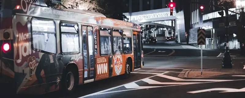 Commercial Bus Wrap Driving Through Salt Lake City at Night